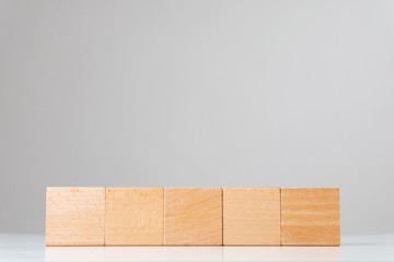 Wooden square cube figures in line isolated