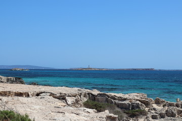 Sea and rocks in Ibiza beach in a sunny day