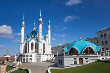 Fototapeta na wymiar Panoramic photo of Kul Sharif Mosque complex, Kazan, Russia. There are square, mosque itself is on background & souvenir pavilion is on right side. These are popular tourist objects in Kazan Kremlin
