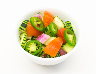 Cucumber Salad homemade (Cucumber,tomatoes,red onions, jalapeno) on white background ,top view.