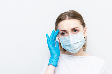 Doctor got sick with coronavirus, woman in a medical mask is not feeling well, white background, copy space