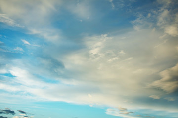 Blue sky with fluffy clouds, abstract background, copy space