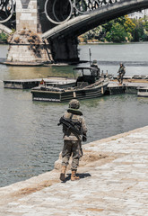 Fototapeta premium Army soldier during military operation in the city. Selective focus. People and military concept.