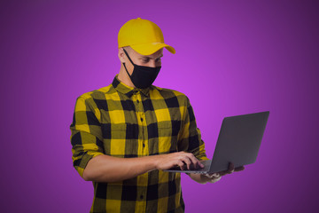 Online ordering man in mask on purple background