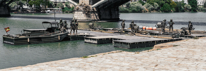 Panoramic scene of Army soldiers during military operation in the river.