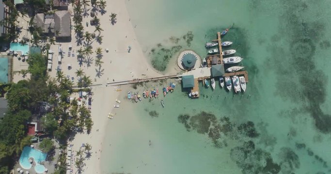 
Dominican Republic aerial shot. Street houses, down town, streets, roads, sea, ocean, waves, palm trees, landscape, coastline, beautiful drone flight.