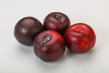 Ripe sweet plum fruit heap