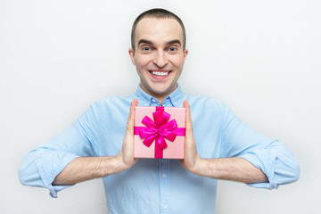 Happy guy received a gift from his girlfriend, portrait, white background