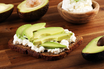 Sandwich with avocado with cream cheese for a healthy breakfast concept