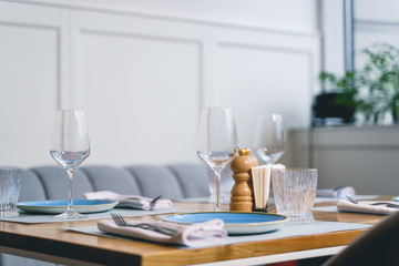 Cafe table served with glasses and plates