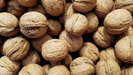 whole walnuts as background