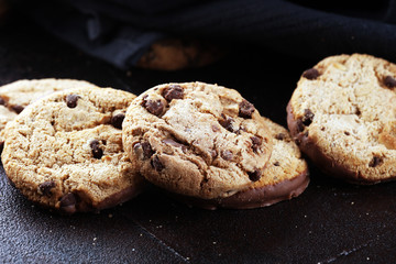 Chocolate cookies on wooden table. Chocolate chip cookies