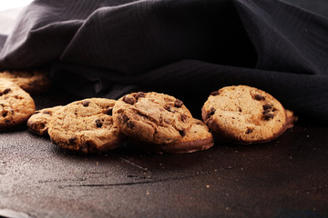 Chocolate cookies on wooden table. Chocolate chip cookies