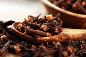 freshly dryed cloves spice texture on background