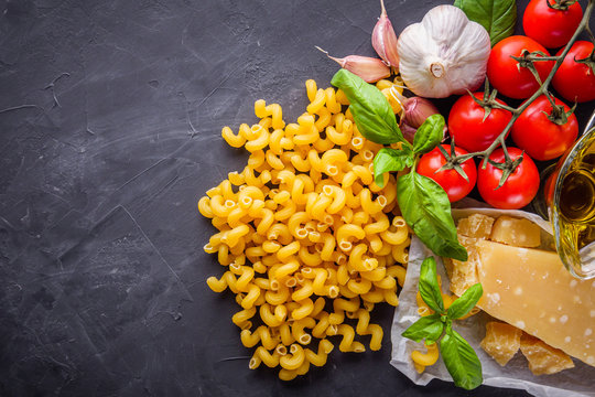 concept of traditional italian pasta with tomatoes and basil