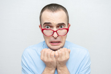 Afraid man in horror, man failed in business, portrait, close-up, white background