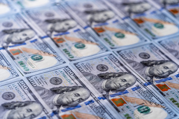 USA dollars. Macro image with selective focus. The hundred dollar banknotes as a background.