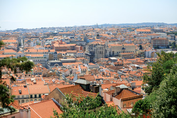 Fototapeta na wymiar Buildings with orange roofs. Summer in Lisbon. Portugal