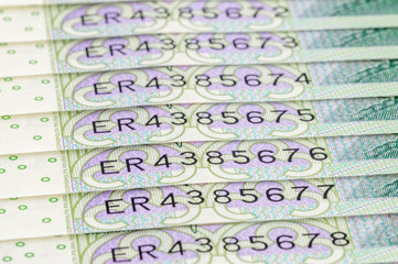 Close-up on serial numbers of new 100 PLN banknotes.