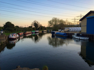 Fototapeta na wymiar Boats on the River Lee Navigation in Enfield, London, United Kingdom