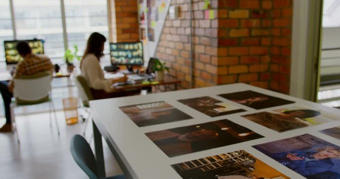 Male and female graphic designers working in a modern office