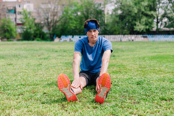 Athlete does warm-up before running at stadium