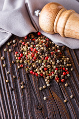 mix of peppercorns on a dark wooden rustic background