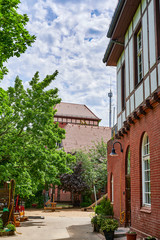 Former historic fire station with a brick facade and half-timbering in Berlin, Germany.