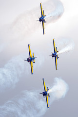 Air Show scene with stunt airplane of aerobatic team performing formation acrobatics