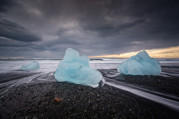 The famous Diamond beach in South Iceland. Giant ice gems on the black lava beach, placed near Jokulsarlon glacier lagoon.