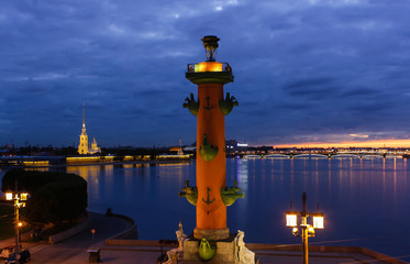 Fototapeta na wymiar Peter and Paul fortress and Rostral column in Saint-Petersburg, Russia, white nights