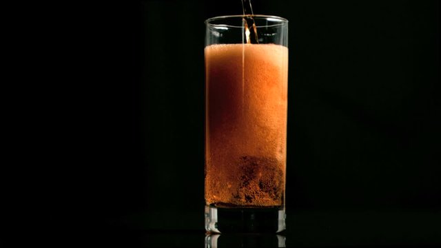 Fizzy refreshment poured in super slow motion