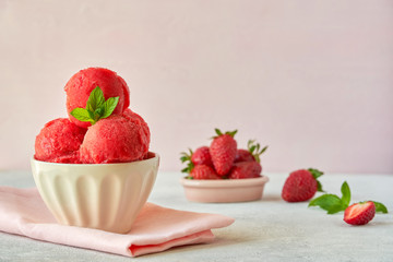 Homemade strawberry, red berry ice cream , sorbet with mint leaves and fresh strawberries