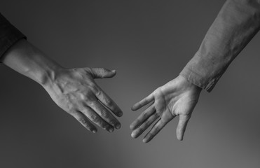 closeup of two hands coming together 