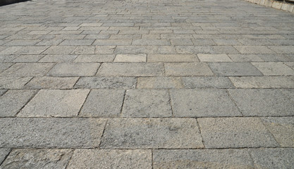 Old cobblestone pavement close-up.