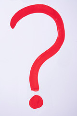 Question drawn in red gouache, white background, copy space, top view, vertical