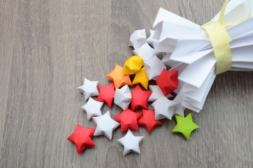 origami lucky stars fall out of paper vase