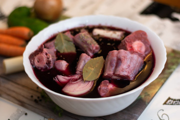 Preparation of a traditional mediterranean oxtail recipe: marination of the oxtail in wine and some species