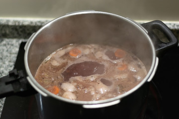 Preparation of a traditional mediterranean oxtail recipe: cooking the oxtail