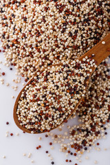 mix of quinoa grains on white acrylic background