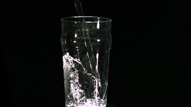 Water filling a pint glass