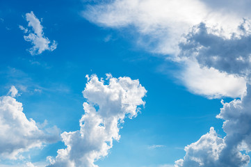 blue sky background with tiny clouds.