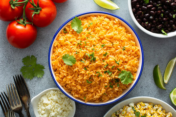Mexican rice with tomatoes and onion served with cilantro