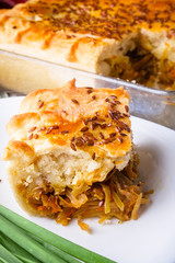 freshly baked cabbage pie on rustic wooden background