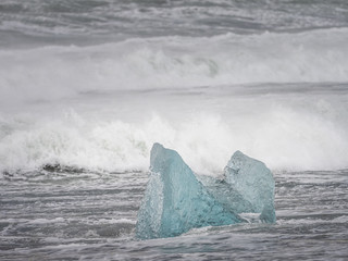 The famous Diamond beach in South Iceland. Giant ice gems on the black lava beach, placed near Jokulsarlon glacier lagoon.