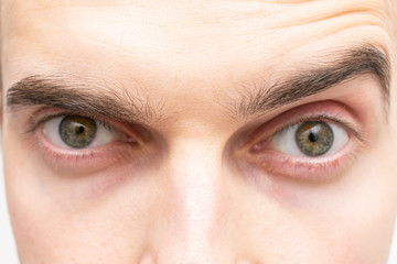 Eyes of a surprised man, close-up