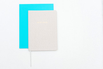 Notebooks on white background, top view, copy space