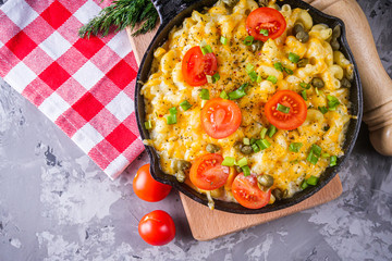delicious pasta and cheese casserole in a cast iron skillet