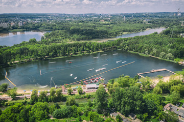 Fototapeta premium Wake cable park on lake Wakeboarding in the city aerial drone photo 