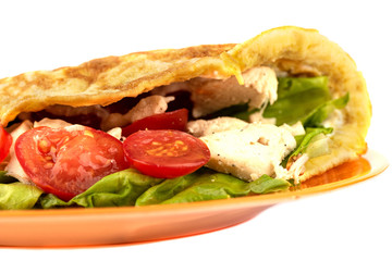 Pancake made from oatmeal, oiled with yogurt and stuffed with chicken fillet, lettuce and tomato.